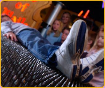 Guests can lie down on a bed of nails at the wonderworks in orlando.